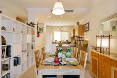 a kitchen and dining room with a table and chairs at Country Home in Arcos de la Frontera