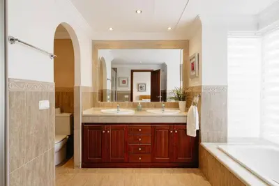 a bathroom with two sinks and a large mirror at Country Home in Arcos de la Frontera