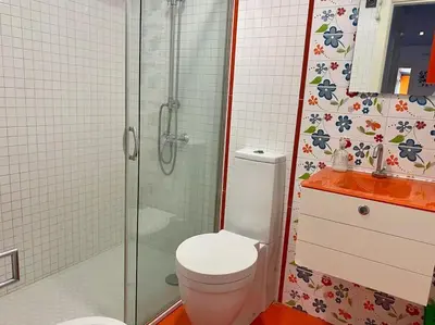 a bathroom with a toilet and a glass shower at APARTAMENTO SALINAS VALDELAGRANA - WiFi, Playa, Piscina in El Puerto de Santa María