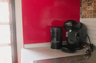 a coffee maker on a shelf in a kitchen at Apartamento El Catavino in Jerez de la Frontera