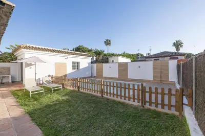 a bathroom with a shower with a shower curtain at Villa del Sol in Novo Sancti Petri