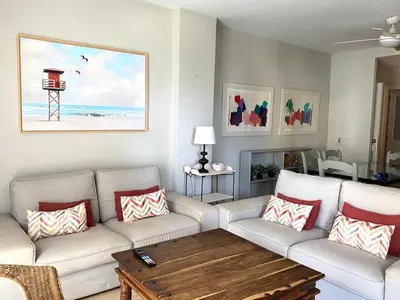 a living room with a couch and a coffee table at Apartamento Buho Real - Vistahermosa in El Puerto de Santa María