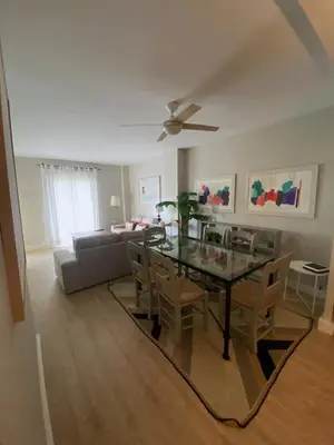 a dining room and living room with a table and chairs at Apartamento Buho Real - Vistahermosa in El Puerto de Santa María