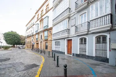 a cobblestone street in front of some buildings at Apartamento El Paseo de la Alameda de Cádiz in Cádiz