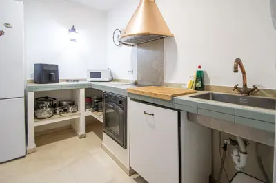 a kitchen with a sink and a counter top at Apartamento El Paseo de la Alameda de Cádiz in Cádiz
