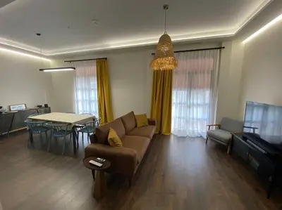 a living room with a couch and a table at Preciosa Casa Centro Histórico Jerez, Parking privado+ WI-FI in Jerez de la Frontera