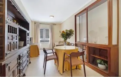 a kitchen with a table and chairs in a room at Colibri in Puerto Real