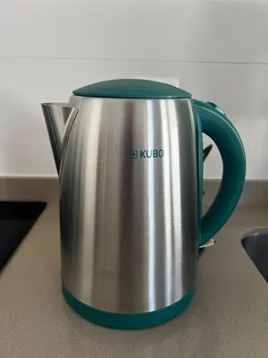 a silver and blue coffee pot sitting on a counter at Colibri in Puerto Real