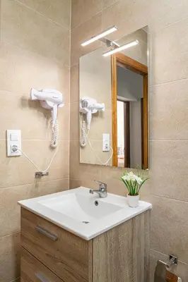a bathroom with a sink and a mirror at Tramontana in Conil de la Frontera