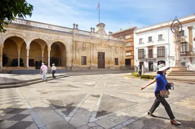 a person walking in front of a building at Apartamento Centrico Jerez de la Frontera in Jerez de la Frontera