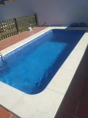 a large blue swimming pool in a house at Bellavista De Conil in Conil de la Frontera