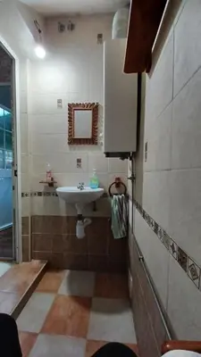 a bathroom with a sink and a mirror at Villa Mi Deseo in Sanlúcar de Barrameda