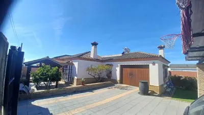 a house with a basketball hoop in front of it at Villa Mi Deseo in Sanlúcar de Barrameda