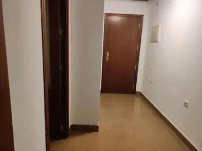 an empty room with a door and a hallway with a floor at Medina-Sidonia. Apartamento. Carrión y La Zaga in Medina Sidonia