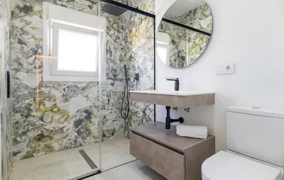 a bathroom with a sink and a mirror at Gorgeous Home In Chiclana De La Fronter in Chiclana de la Frontera