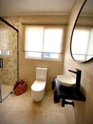 a bathroom with a toilet and a sink and a mirror at MyChoice Salmarina in Rota