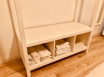 a white cabinet with folded towels in a room at Disfruta, nuevo en Mentidero in Cádiz