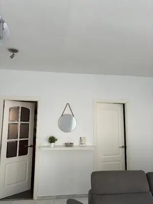 a living room with a couch and a light fixture at Ocón 2 in Lebrija