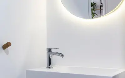 a bathroom with a sink and a mirror at Secreto de Lola in El Puerto de Santa María