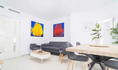a desk in a room with a white wall at Secreto de Lola in El Puerto de Santa María