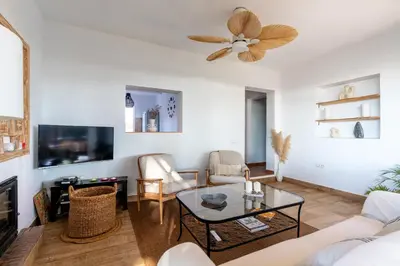 a living room with a couch and a table at Chalet playa la Barrosa, Chiclana in Chiclana de la Frontera
