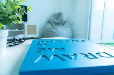 a blue book sitting on top of a desk at Sunset Puerto Sherry in El Puerto de Santa María