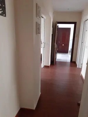 an empty room with a hallway with a door at La Perla de Cádiz by Gades Gestión in Cádiz