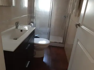 a bathroom with a sink and a toilet and a shower at La Perla de Cádiz by Gades Gestión in Cádiz