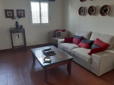 a living room with a couch and a coffee table at La Perla de Cádiz by Gades Gestión in Cádiz