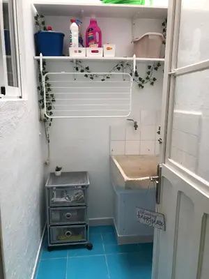 a small bathroom with a sink and a sinkessment at Céntrico Rota Beach. in Rota