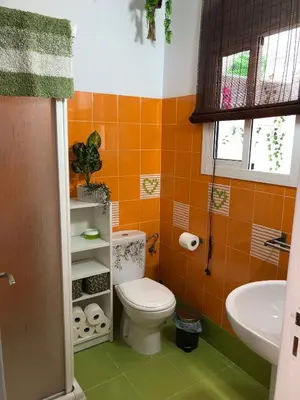 a bathroom with a toilet and a sink at Céntrico Rota Beach. in Rota