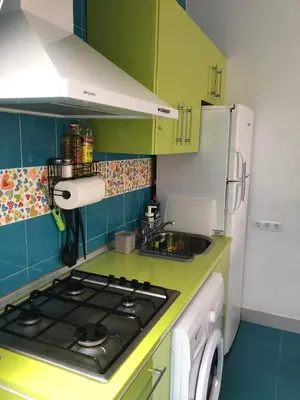 a small kitchen with a stove and a sink at Céntrico Rota Beach. in Rota