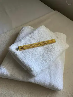 a pencil sitting on top of a pile of towels at Apartamentos Corredera 2 in Arcos de la Frontera