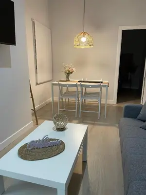 a living room with a couch and a table at Apartamentos Corredera 2 in Arcos de la Frontera