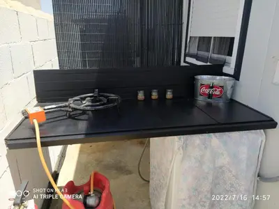 a black table with a gas stove in a room at Casa, Sueños del Sur in Chiclana de la Frontera