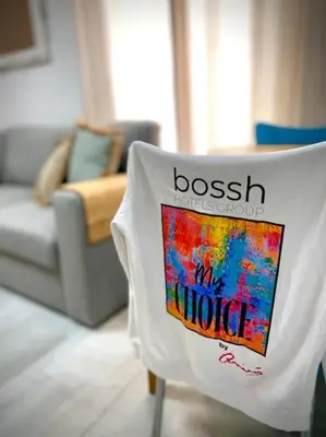a towel on the back of a chair in a living room at MyChoice Pitiusa in Rota