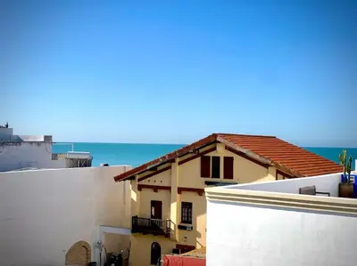 a view of a house with the ocean in the background at MyChoice Pitiusa in Rota