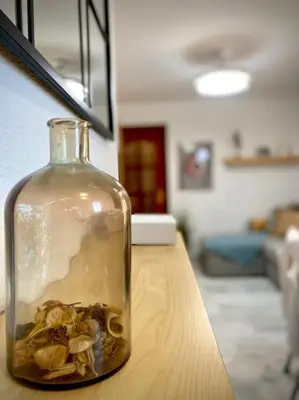a bottle with mushrooms in it sitting on a table at MyChoice Pitiusa in Rota