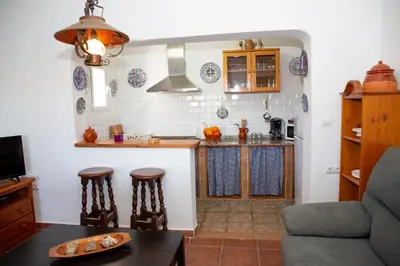 a kitchen with a table and a counter top at Casa rural con piscina en Conil de la Frontera - Casa Oeste in Cádiz