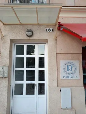 a front door of a building with a sign on it at Apartamento El Niño de Oro in Sanlúcar de Barrameda