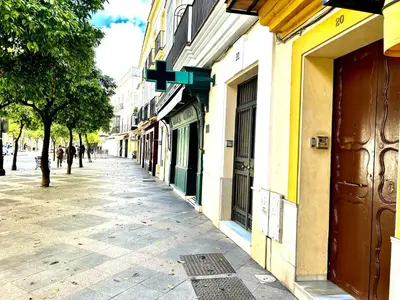 an empty street in a city with buildings at Alojanómadas Jerez Centro in Jerez de la Frontera
