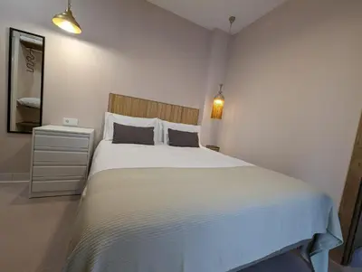 a bedroom with a large white bed in a room at Mina32 by 7Escalones in Rota