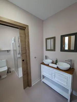 a bathroom with two sinks and a shower and a toilet at Mina32 by 7Escalones in Rota