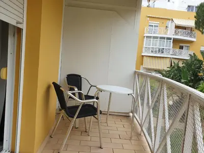 a balcony with two chairs and a table at Las Antillas by RentCadiz in El Puerto de Santa María