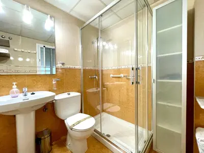 a bathroom with a shower and a toilet and a sink at Las Antillas by RentCadiz in El Puerto de Santa María