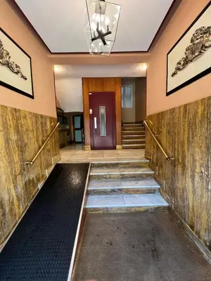 a hallway with wooden walls and a door and stairs at Apartamento Porvenir in Jerez de la Frontera