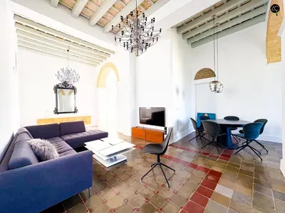 a living room with a couch and a table at Casa Plaza Candelaria Cádiz Grupo AC Gestión in Cádiz