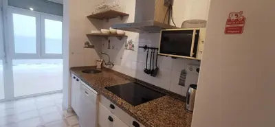 a kitchen with a sink and a counter top at ARENA y Mar Sunny Home by Cadiz4Rentals in Cádiz