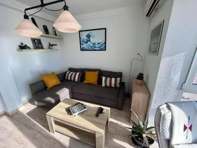 a living room with a couch and a coffee table at ARENA y Mar Sunny Home by Cadiz4Rentals in Cádiz