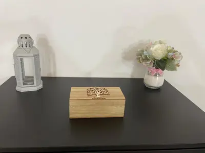 a black table with a vase of flowers and a candle at Casa Delia in Bornos